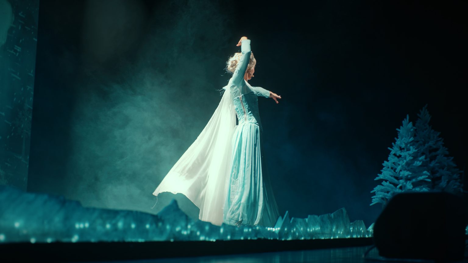 Video shoot: camera in the foreground and an actor on set in a bar